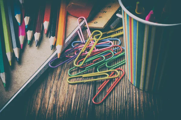 Retro colored pencils and paper clips