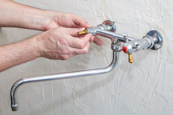 Two handle kitchen faucet repair, plumber hands replacement  tap