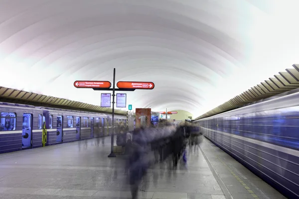 Passengers are on platform at  underground station in  Russian subway