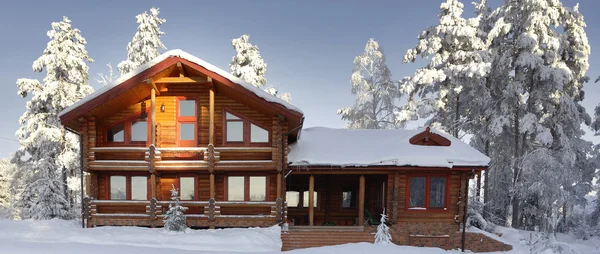 Log cabin with large windows, balcony and porch, modern house.