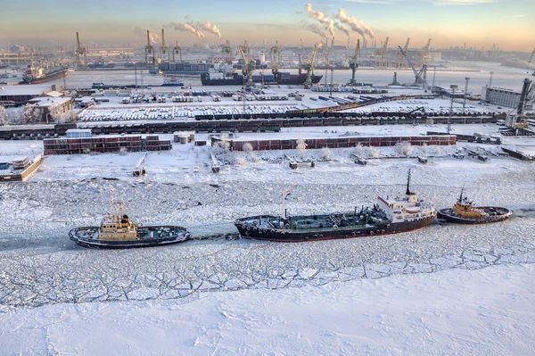 Top view of icebound sea channel, commercial port Saint-Petersburg, Russia.