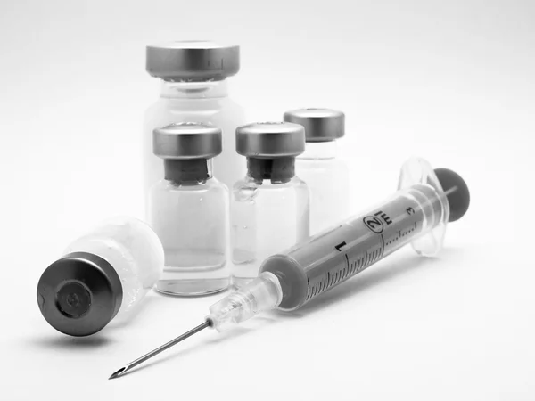 Medical syringe and phials.