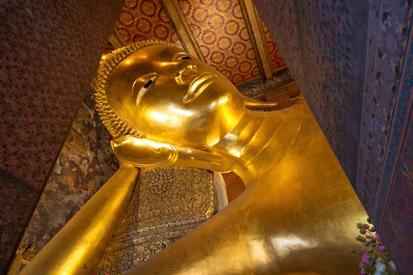 The Big golden Reclining Buddha within Wat Pho is the important in Bangkok, Thailand