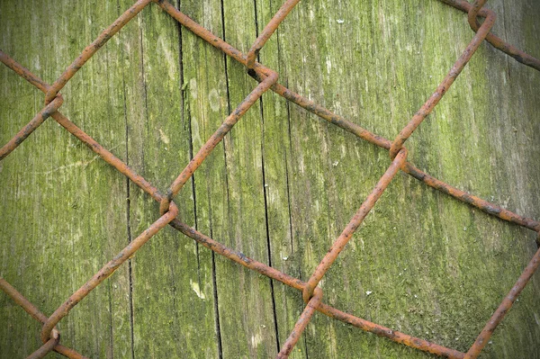 Wire fence rust texture background with wood