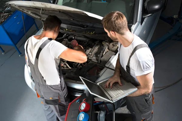 Mechanic team repair car