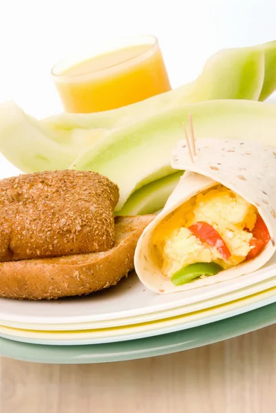 Breakfast Burrito Served with Honeydew Melon Toast and Juice