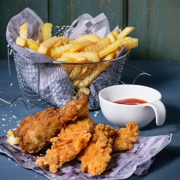 Chicken fries with fried potatoes