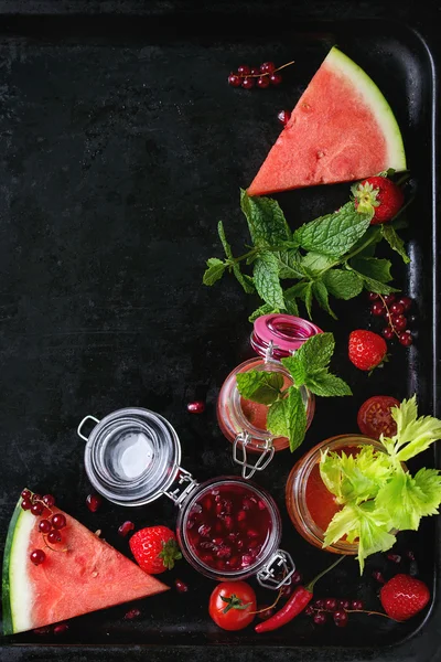 Jars of red smoothies