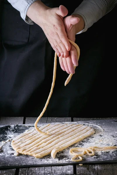 Making pasta by female hands