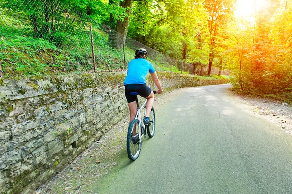 Cyclist pedaling uphill