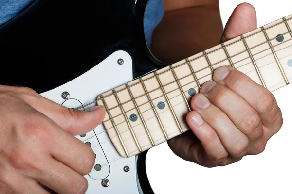 Hands of man playing electric guitar