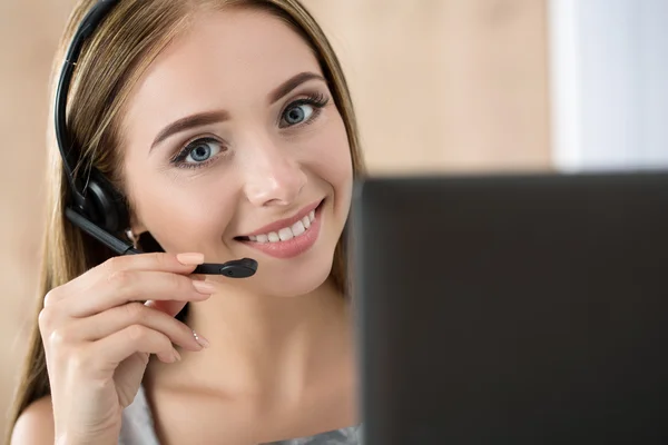 Portrait of beautiful call center operator at work