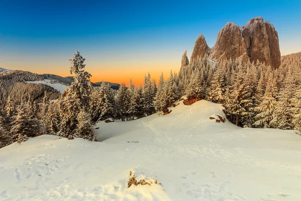 Fantastic sunset and winter landscape,Lonely-Rock,Carpathians,Romania,Europe