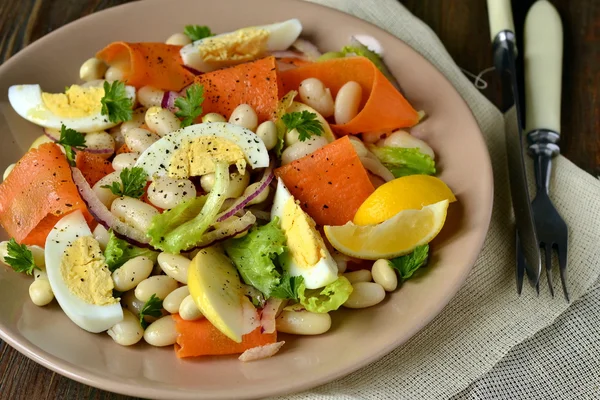 Salad with beans, egg, carrot and apple