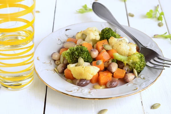 Broccoli, cauliflower, squash and beans with pumpkin seeds