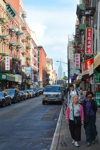 People walk on street of Chinatown