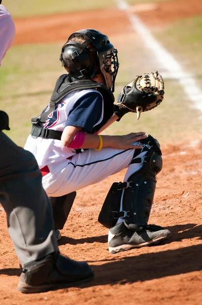 Little league catcher during game