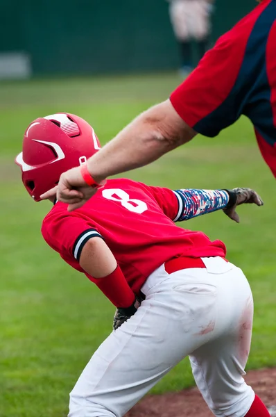 Little league baseball player on base