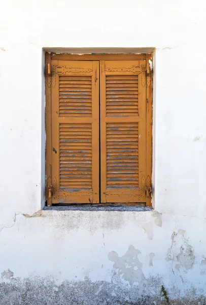 Window with brown shutters