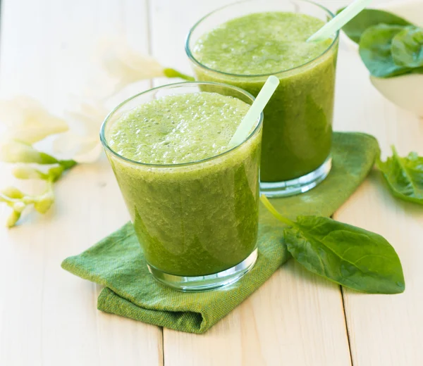 Green fresh healthy smoothies with fruits and vegetables