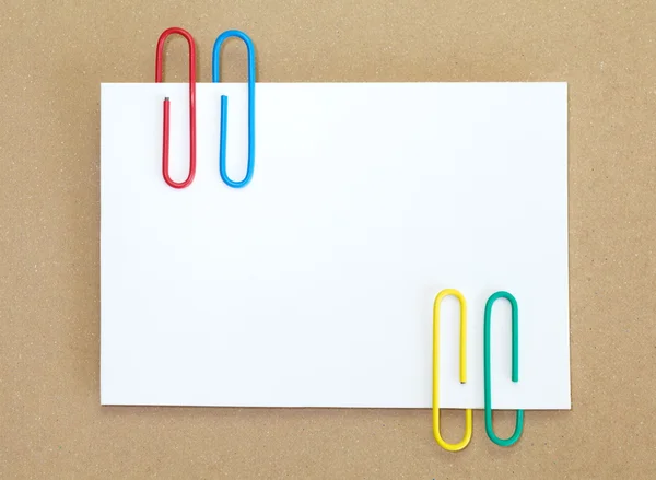 Color metal paper clip and blank white paper note