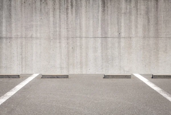 Car parking and concrete wall