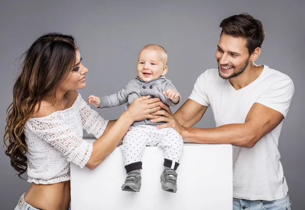 Young parents with cute child