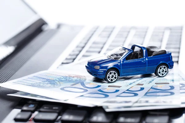 Toy car and banknotes