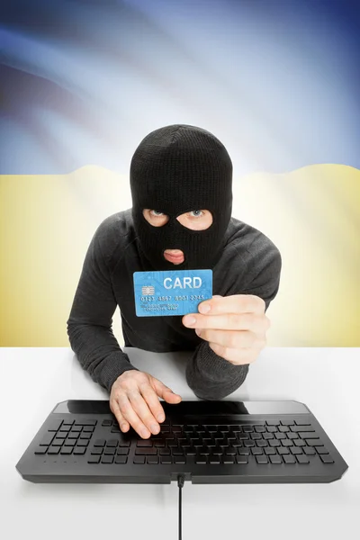 Cybercrime concept with national flag on background - Ukraine