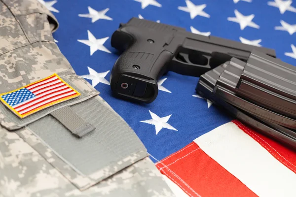 Handgun over US flag - close up studio shoot