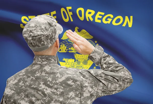 Soldier saluting to US state flag series - Oregon