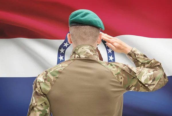 Soldier saluting to USA state flag conceptual series - Missouri