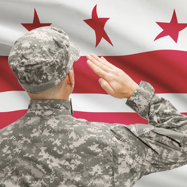 Soldier saluting to US state flag series - District of Columbia