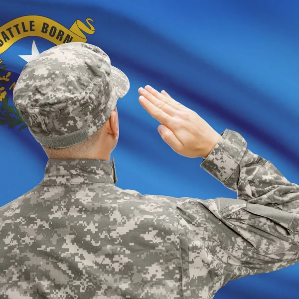 Soldier saluting to US state flag series - Nevada