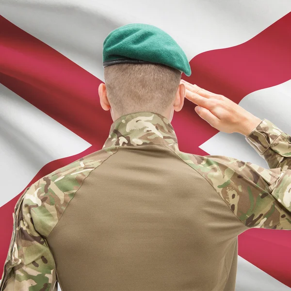 Soldier saluting to USA state flag conceptual series - Alabama