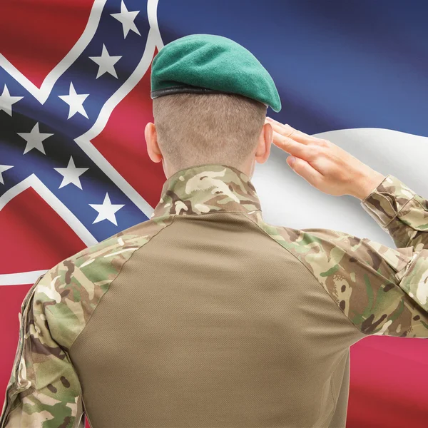 Soldier saluting to USA state flag conceptual series - Mississip