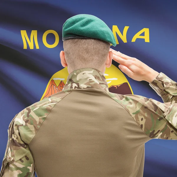 Soldier saluting to USA state flag conceptual series - Montana