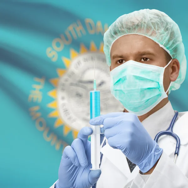 Doctor with syringe in hands and US states flags series - South Dakota