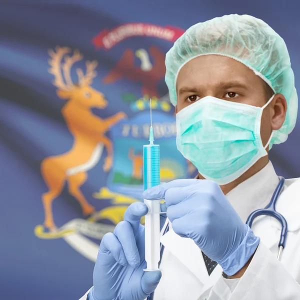 Doctor with syringe in hands and US states flags series - Michigan