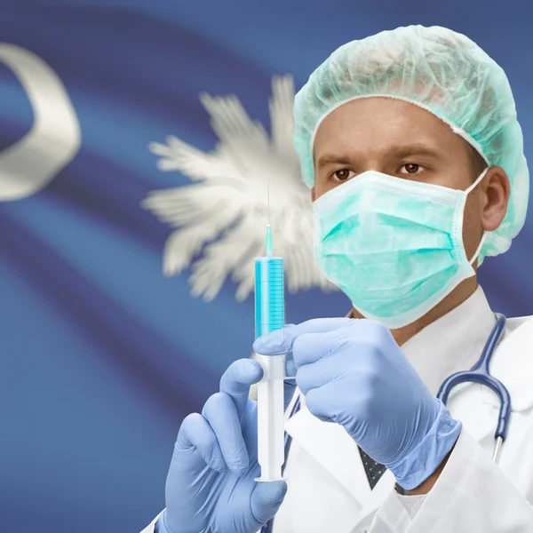 Doctor with syringe in hands and US states flags series - South Carolina