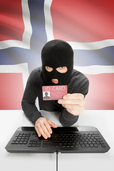 Hacker with flag on background holding ID card in hand - Norway