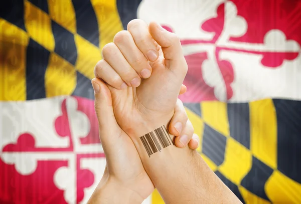 Barcode ID number on wrist and USA states flags on background - Maryland