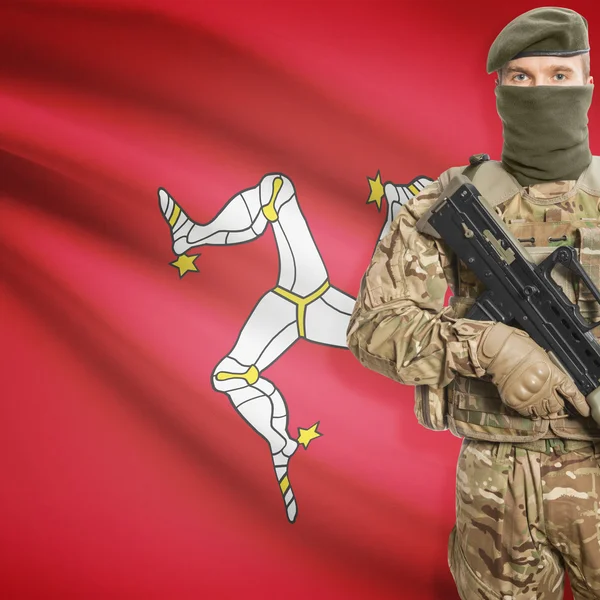 Soldier with machine gun and flag on background - Isle of Man