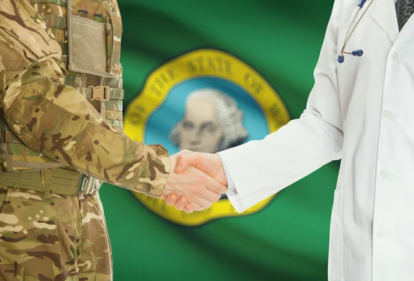 Military man in uniform and doctor shaking hands with US states flags on background - Washington