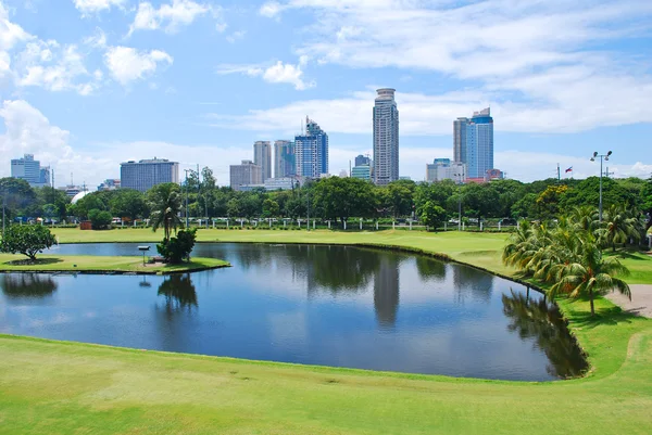 Golf Course Green with City Background