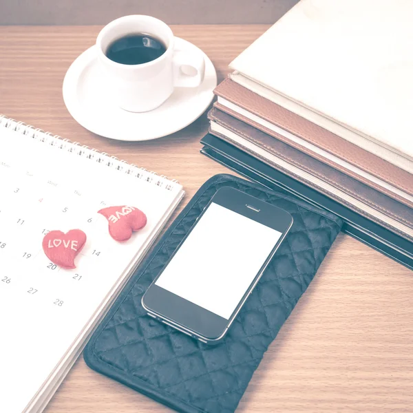 Office desk : coffee with phone,wallet,calendar,heart,stack of b