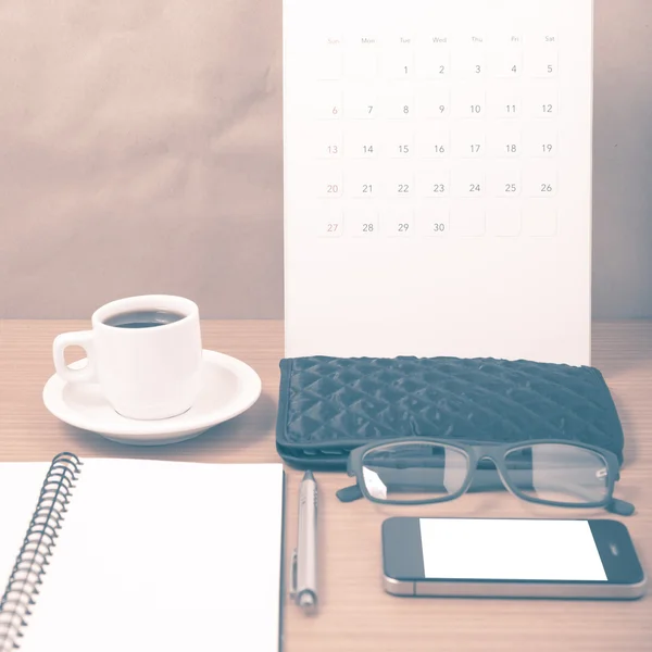 Office desk : coffee with phone,calendar,wallet,notepad vintage