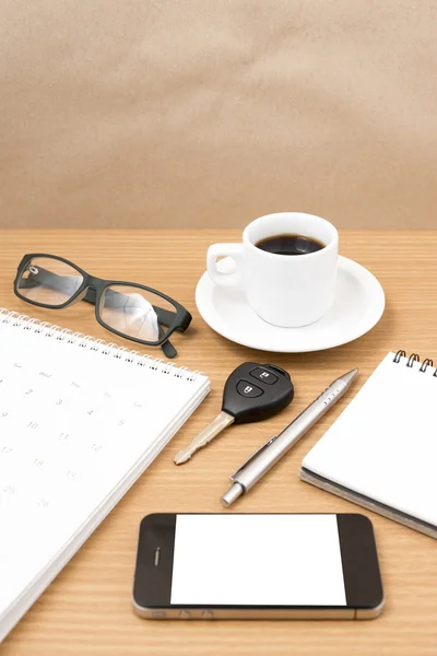 Coffee and phone with car key,eyeglasses,notepad,calendar