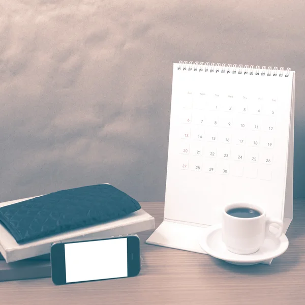 Working table : coffee with phone,stack of book and wallet vinta