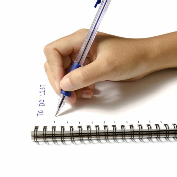 Woman hand writing with pen on notebook